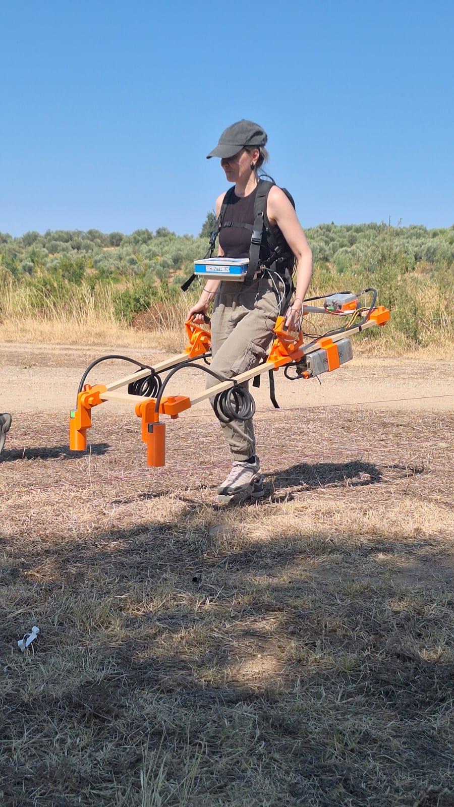 Jona conducting geophysical fieldwork survey
