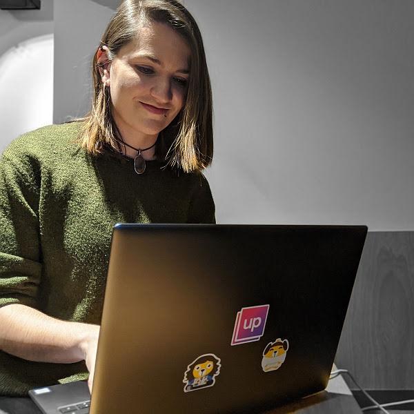 Jona working on a laptop during a research project