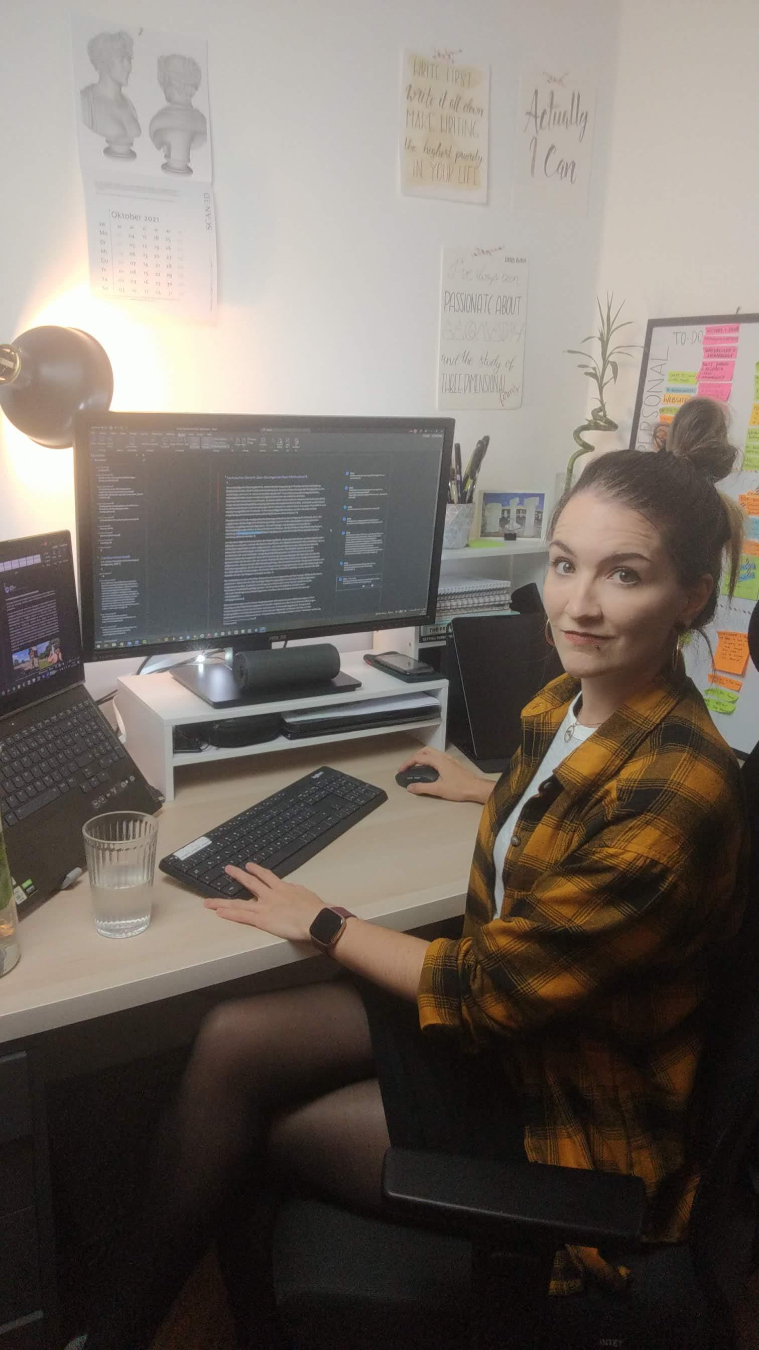 Jona working at the desk on illustrations